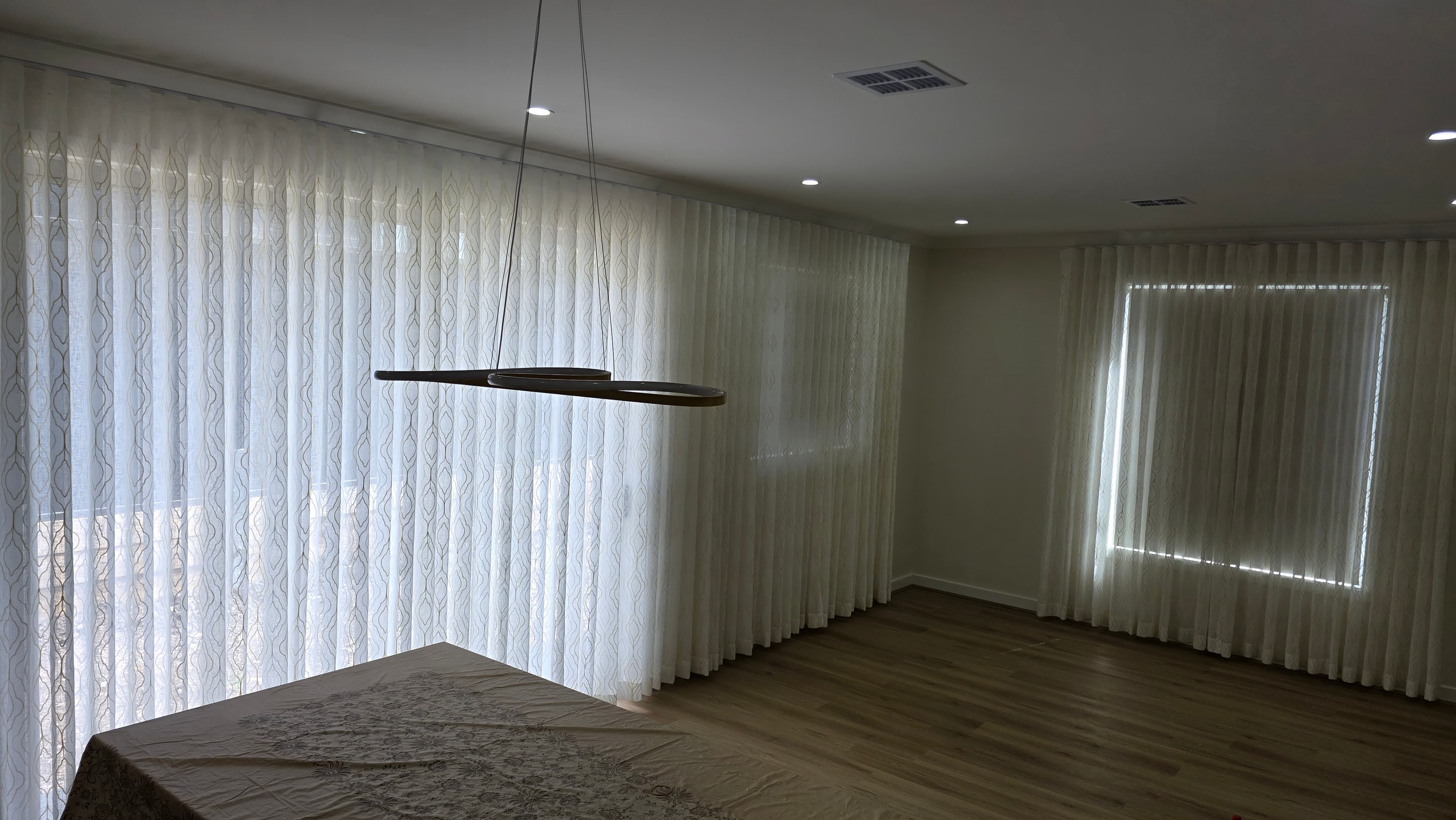Sheer S-fold curtains spanning full wall of a room — locally made in Melbourne